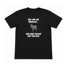 Stur wie ein Maulesel – Unisex T-Shirt – Schwarz – Flat-Lay Vorderseite (Mockup)